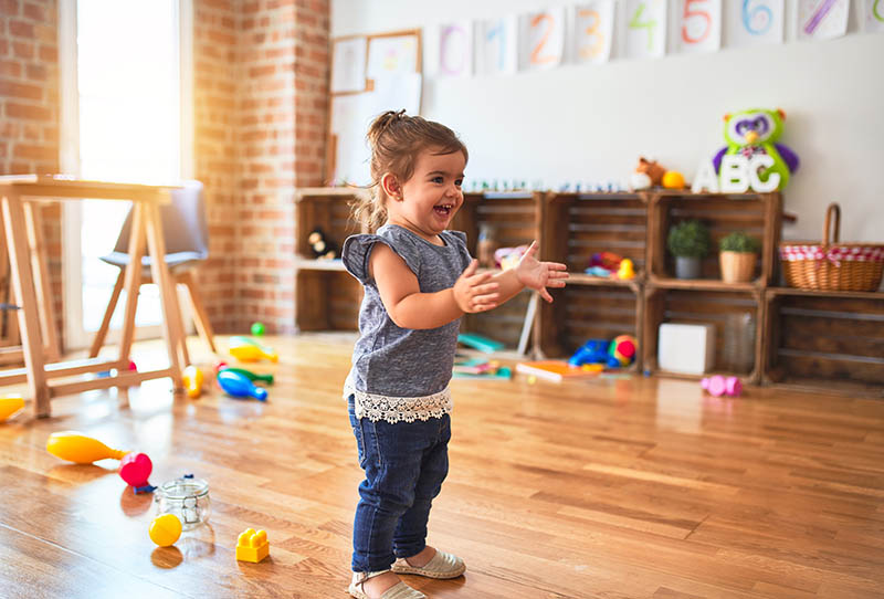 Excited toddler in playroom